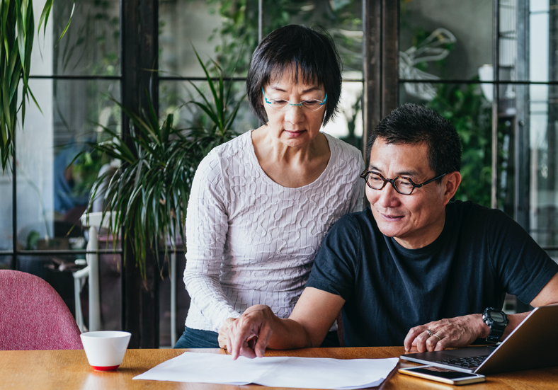 Couple working on planning retirement finances together